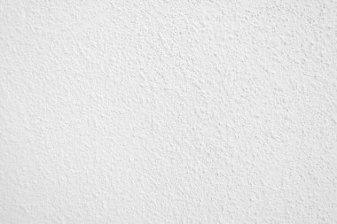 Beyaz beton duvarın pürüzsüz dokusu kaba bir yüzey, metin için boşluk, arkaplan için alan.