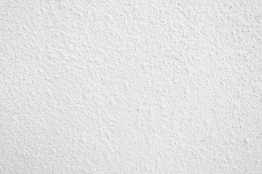 Beyaz beton duvarın pürüzsüz dokusu kaba bir yüzey, metin için boşluk, arkaplan için alan.