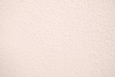 Seamless texture of pacific pink cement wall a rough surface, with space for text, for a background..	