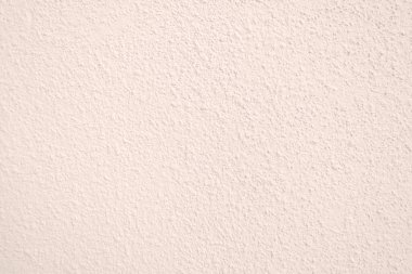 Seamless texture of pacific pink cement wall a rough surface, with space for text, for a background..	