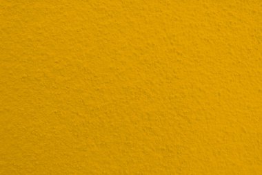 Seamless texture of yellow cement old wall a rough surface, with space for text, for a background.	