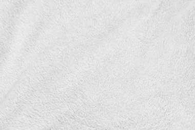 White clean wool texture background. light natural sheep wool. white seamless cotton. texture of fluffy fur for designers. close-up fragment white wool carpet.	