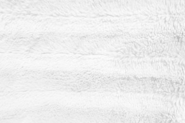 White clean wool texture background. light natural sheep wool. white seamless cotton. texture of fluffy fur for designers. close-up fragment white wool carpet.	