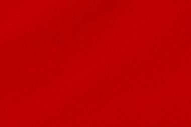 Red clean wool texture background. light natural sheep wool. red seamless cotton. texture of fluffy fur for designers. close-up fragment red wool carpet.	