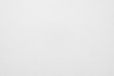 Beyaz beton duvarın pürüzsüz dokusu kaba bir yüzey, metin için boşluk, arkaplan için alan.