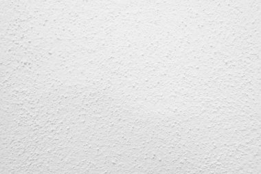 Beyaz beton duvarın pürüzsüz dokusu kaba bir yüzey, metin için boşluk, arkaplan için alan.