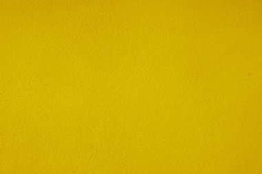 Seamless texture of yellow cement wall a rough surface, floor concrete, with space for text, for a background.	