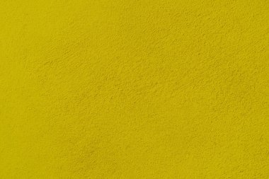 Seamless texture of yellow cement wall a rough surface, floor concrete, with space for text, for a background.	