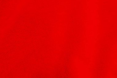 Red clean wool texture background. light natural sheep wool. white seamless cotton. texture of fluffy fur for designers. close-up fragment red wool carpet.	