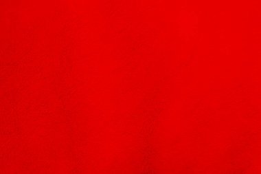 Red clean wool texture background. light natural sheep wool. white seamless cotton. texture of fluffy fur for designers. close-up fragment red wool carpet.	