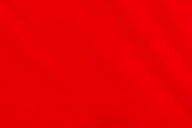 Red clean wool texture background. light natural sheep wool. white seamless cotton. texture of fluffy fur for designers. close-up fragment red wool carpet.	