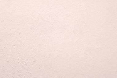 Seamless texture of pacific pink cement wall a rough surface, with space for text, for a background...	