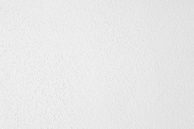 Seamless texture of white cement wall a rough surface, with space for text, for a background..	