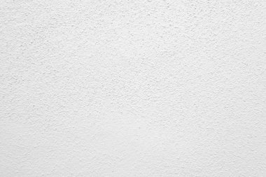 Beyaz beton duvarın pürüzsüz dokusu kaba bir yüzey, metin için boşluk, arkaplan için alan.