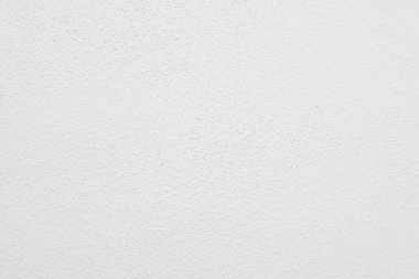 Beyaz beton duvarın pürüzsüz dokusu kaba bir yüzey, metin için boşluk, arkaplan için alan.