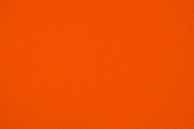 Renkli turuncu çimento eski duvarın pürüzsüz dokusu kaba bir yüzey, yazı için yeri var, arka plan için..