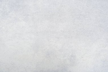 Beyaz kadife kumaş dokusu arka plan olarak kullanılıyor. Yumuşak ve pürüzsüz tekstil malzemelerinin boş beyaz kumaş arka planı. Metin için boşluk var.