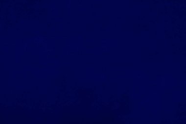 Dark blue velvet fabric texture used as background. Empty dark blue fabric background of soft and smooth textile material. There is space for text.	