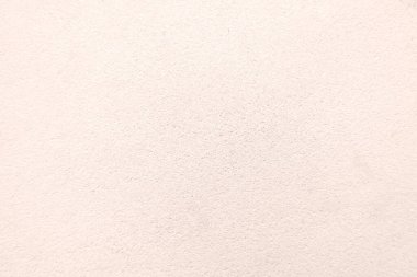 Seamless texture of pacific pink cement wall a rough surface, with space for text, for a background..	