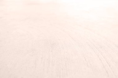 Seamless texture of pacific pink cement wall a rough surface, with space for text, for a background..	