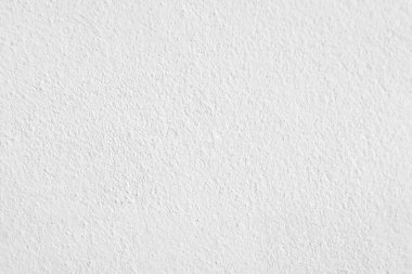 Beyaz beton duvarın pürüzsüz dokusu kaba bir yüzey, metin için boşluk, arkaplan için alan.