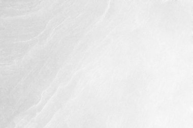 Beyaz taş dokusunun yüzeyi pürüzlü, gri-beyaz tonda. Duvar kağıdı veya arkaplan resmi için bunu kullanın. Metin için boş bir boşluk var