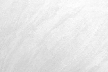 Beyaz taş dokusunun yüzeyi pürüzlü, gri-beyaz tonda. Duvar kağıdı veya arkaplan resmi için bunu kullanın. Metin için boş bir boşluk var