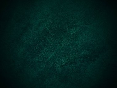 Dark green old velvet fabric texture used as background. Empty green fabric background of soft and smooth textile material. There is space for text..	