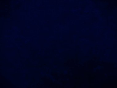 Dark blue velvet fabric texture used as background. Empty dark blue fabric background of soft and smooth textile material. There is space for text.	