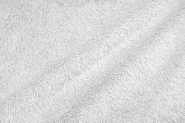 White clean wool texture background. light natural sheep wool. white seamless cotton. texture of fluffy fur for designers. close-up fragment white wool carpet..	