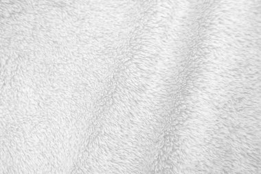 White clean wool texture background. light natural sheep wool. white seamless cotton. texture of fluffy fur for designers. close-up fragment white wool carpet..	