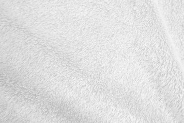 White clean wool texture background. light natural sheep wool. white seamless cotton. texture of fluffy fur for designers. close-up fragment white wool carpet..	