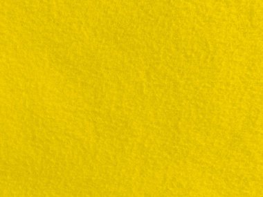 Felt yellow soft rough textile material background texture close up,poker table,tennis ball,table cloth. Empty yellowfabric background..	