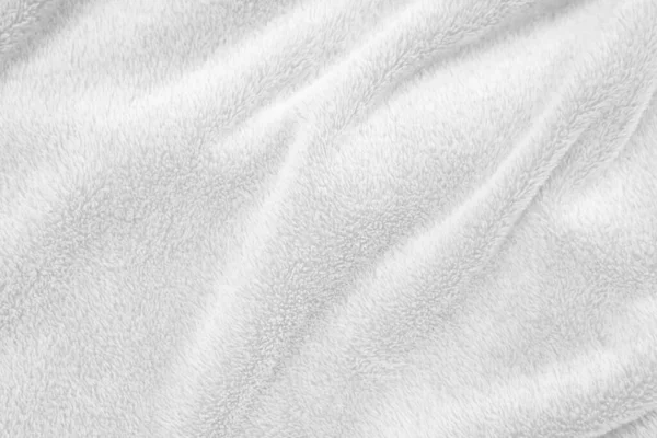 White clean wool texture background. light natural sheep wool. white seamless cotton. texture of fluffy fur for designers. close-up fragment white wool carpet..	