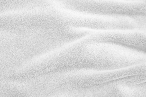 Beyaz, temiz yün dokusu arka planda. hafif doğal koyun yünü. Beyaz, pürüzsüz pamuk. Tasarımcılar için tüylü kürk dokusu. yakın plan beyaz yün halı..