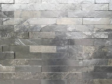 Seamless texture of white grey brick stone wall a rough surface, with space for text, for a background.	