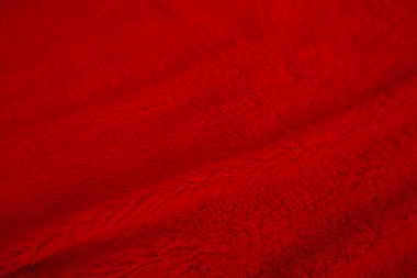 Red clean wool texture background. light natural sheep wool. red seamless cotton. texture of fluffy fur for designers christmas day. close-up fragment red wool carpet..	