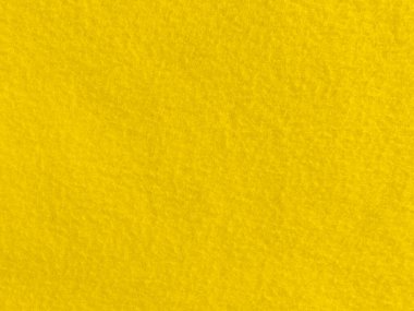 Felt yellow soft rough textile material background texture close up,poker table,tennis ball,table cloth. Empty yellowfabric background..	