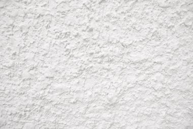 Seamless texture of white cement wall a rough surface, with space for text, for a background..	