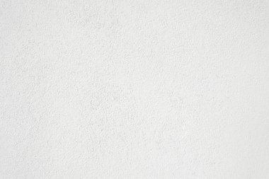 Seamless texture of white cement wall a rough surface, with space for text, for a background..	