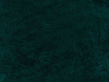 Dark green old velvet fabric texture used as background. Empty green fabric background of soft and smooth textile material. There is space for text..	