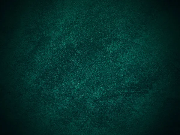 Dark green old velvet fabric texture used as background. Empty green fabric background of soft and smooth textile material. There is space for text..	