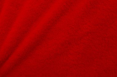 Red clean wool texture background. light natural sheep wool. red seamless cotton. texture of fluffy fur for designers. close-up fragment red wool carpet.	