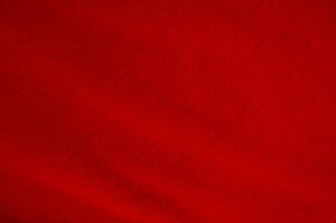 Red clean wool texture background. light natural sheep wool. red seamless cotton. texture of fluffy fur for designers. close-up fragment red wool carpet.	