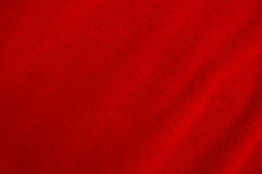 Red clean wool texture background. light natural sheep wool. red seamless cotton. texture of fluffy fur for designers. close-up fragment red wool carpet.	