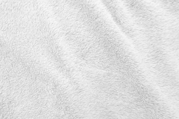 Beyaz, temiz yün dokusu arka planda. hafif doğal koyun yünü. Beyaz, pürüzsüz pamuk. Tasarımcılar için tüylü kürk dokusu. yakın plan beyaz yün halı..