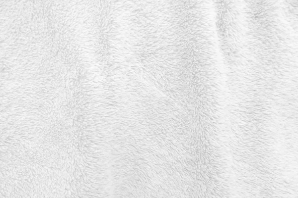 Beyaz, temiz yün dokusu arka planda. hafif doğal koyun yünü. Beyaz, pürüzsüz pamuk. Tasarımcılar için tüylü kürk dokusu. yakın plan beyaz yün halı..