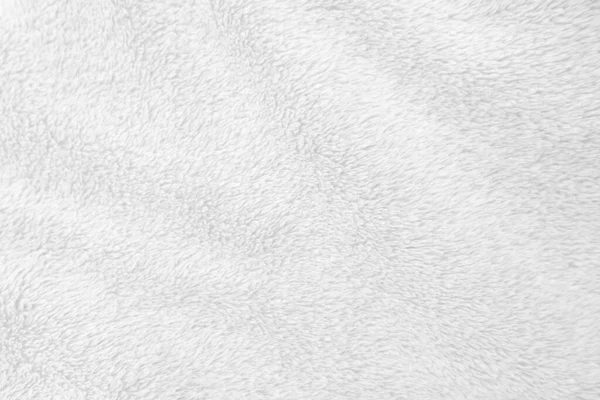 Beyaz, temiz yün dokusu arka planda. hafif doğal koyun yünü. Beyaz, pürüzsüz pamuk. Tasarımcılar için tüylü kürk dokusu. yakın plan beyaz yün halı..