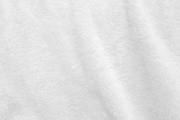 Beyaz, temiz yün dokusu arka planda. hafif doğal koyun yünü. Beyaz, pürüzsüz pamuk. Tasarımcılar için tüylü kürk dokusu. yakın plan beyaz yün halı..