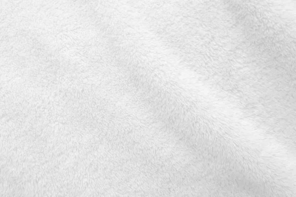 Beyaz, temiz yün dokusu arka planda. hafif doğal koyun yünü. Beyaz, pürüzsüz pamuk. Tasarımcılar için tüylü kürk dokusu. yakın plan beyaz yün halı..